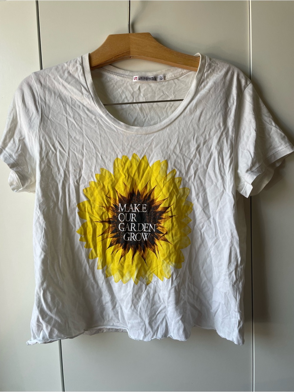 Uniqlo White Short-Sleeve Tee with Yellow Sunflower Graphic